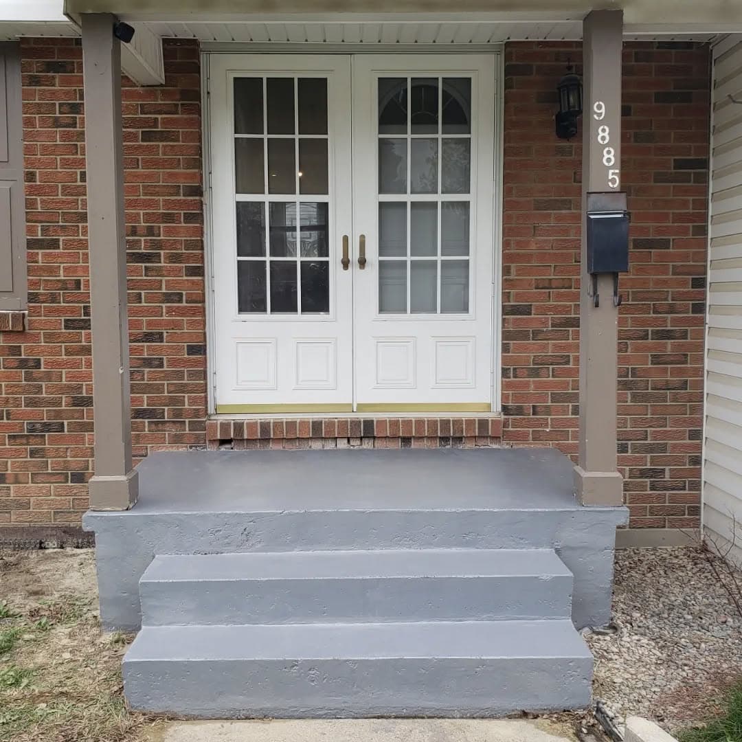 Finished porch steps by the front door