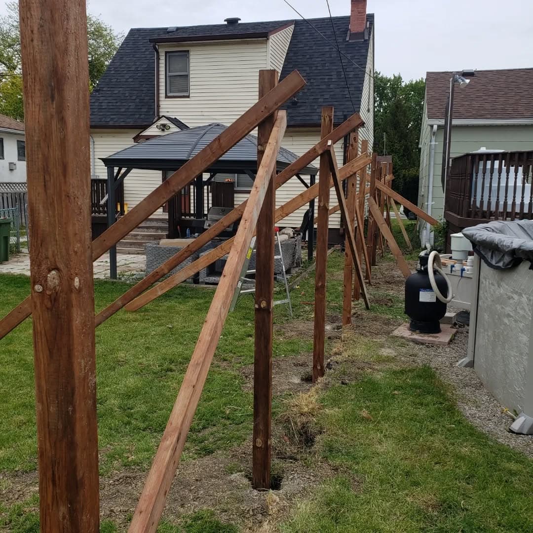 New fence posts set and braced during construction