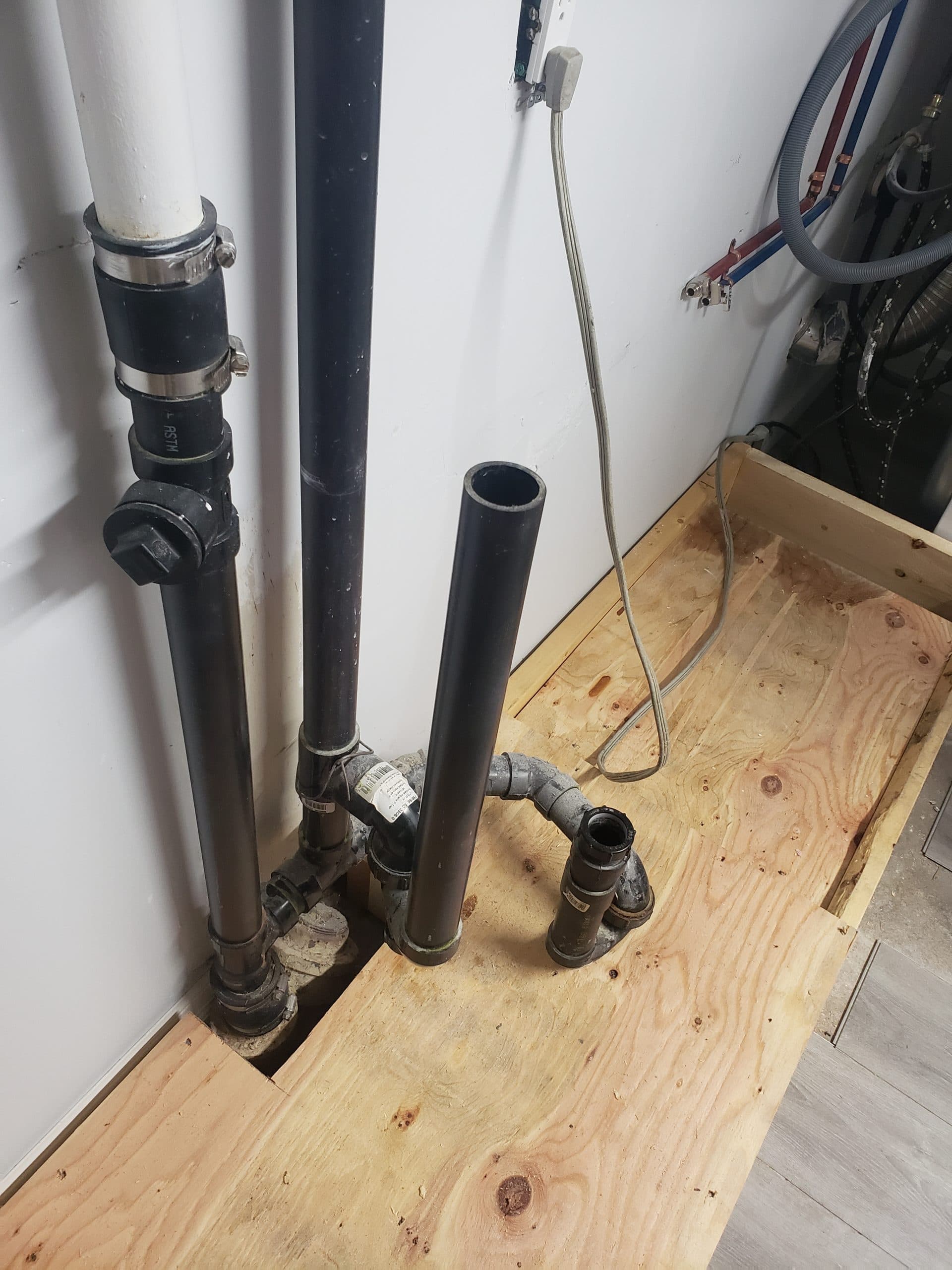 New supply and drain lines roughed in during the plumbing stage