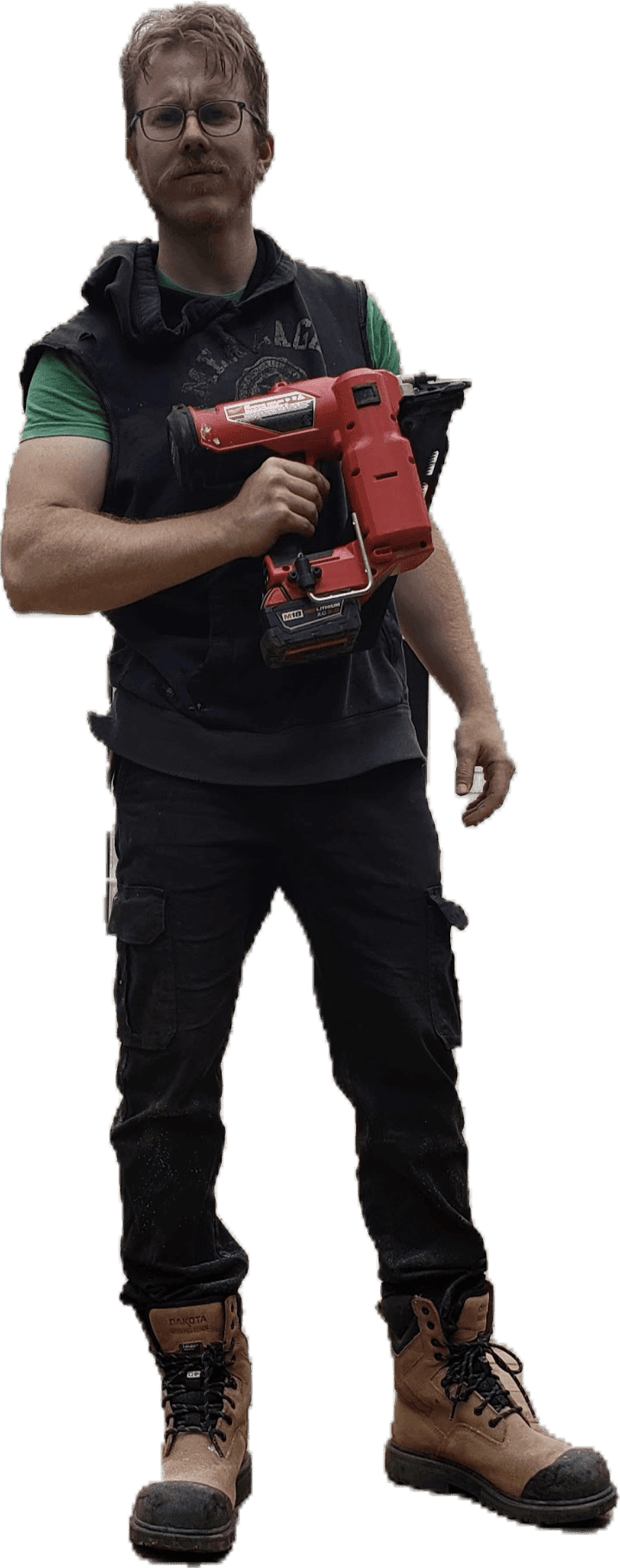 Sam Molloy, owner of Big Red Builds, holding a framing nailer
